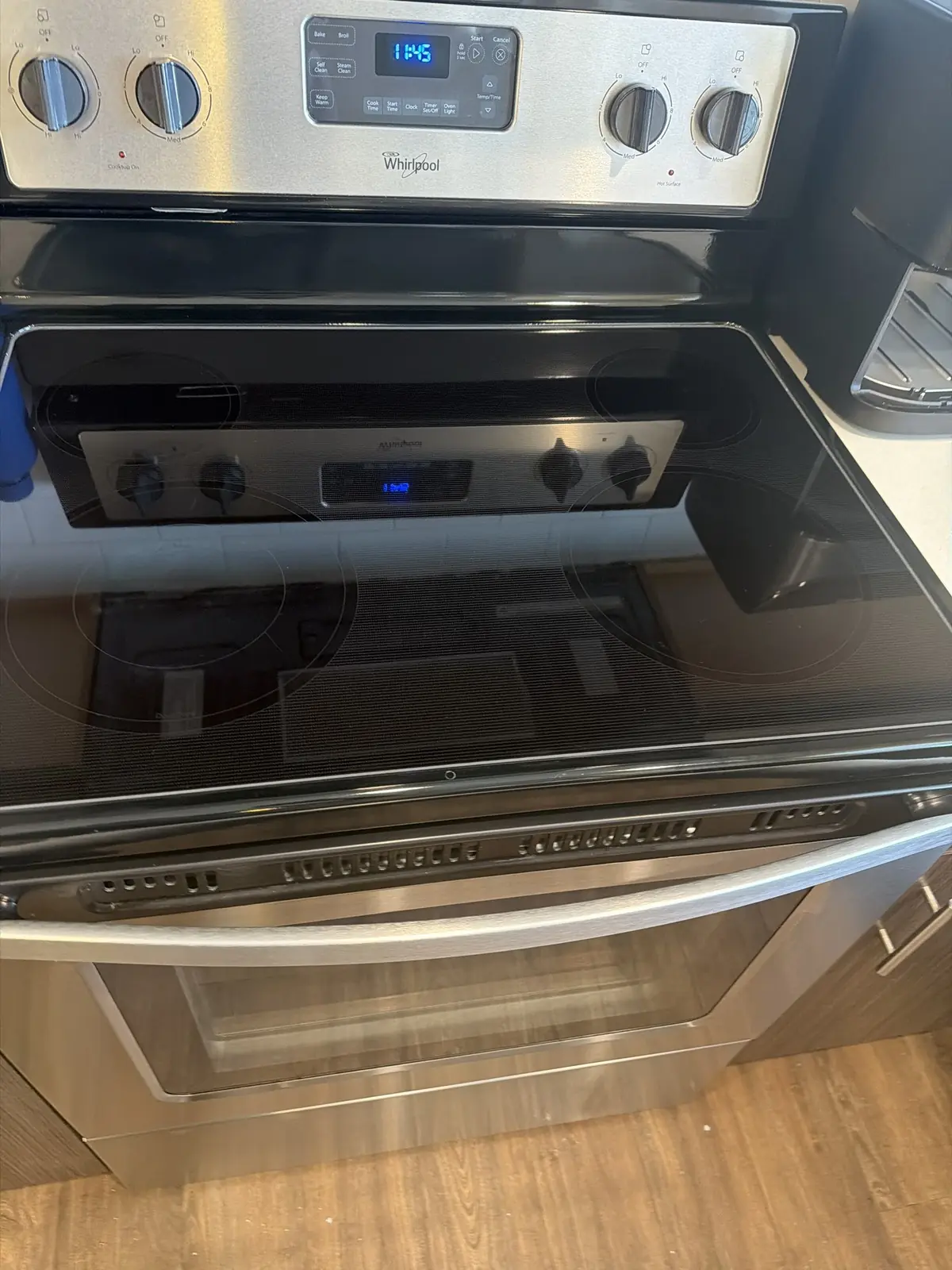 After: A glass-top electric range and its oven door