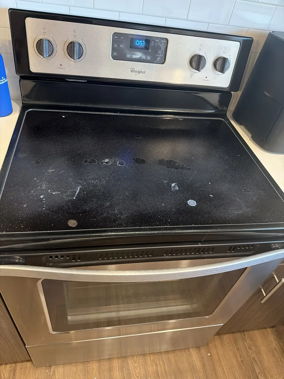 Before: A glass-top electric range and its oven door