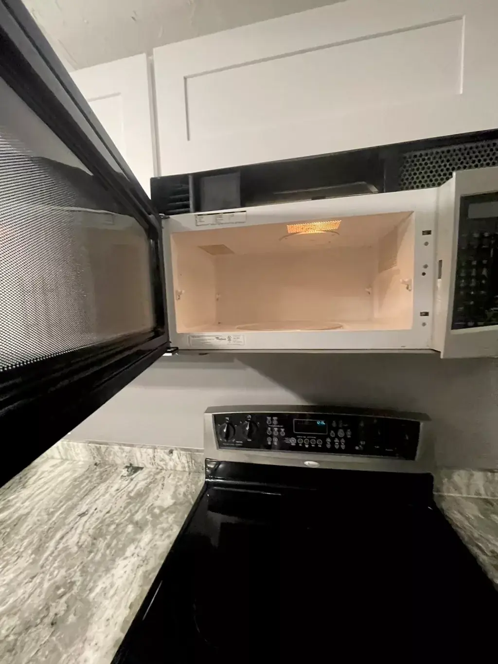 After: Over-the-range microwave: splattered ceiling and walls, then wiped spotless